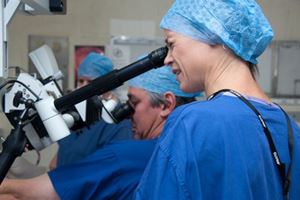 A surgical operating microscope in use