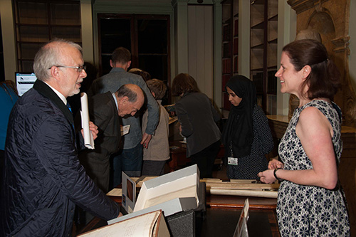 A visitor discussing a book on display