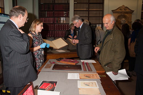 Visitors discussing the objects on display