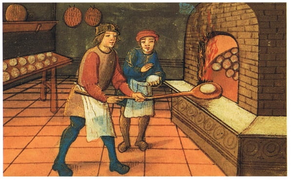 A medieval baker with his apprentice