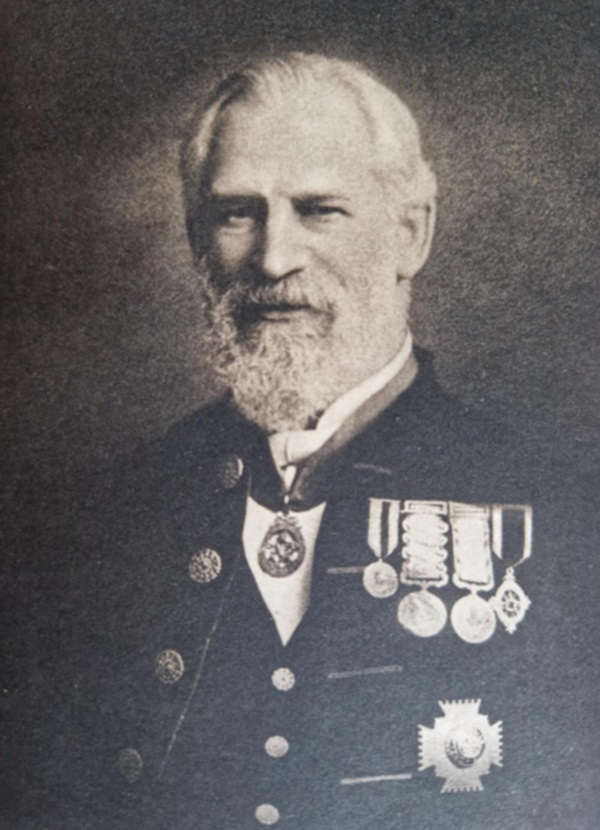 Photograph of an older man with a beard, in uniform with medals